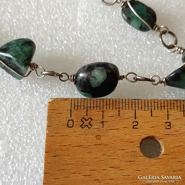 Untreated emerald necks on leather at a good price!