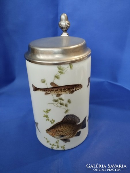 Jug depicting fish with a tin lid