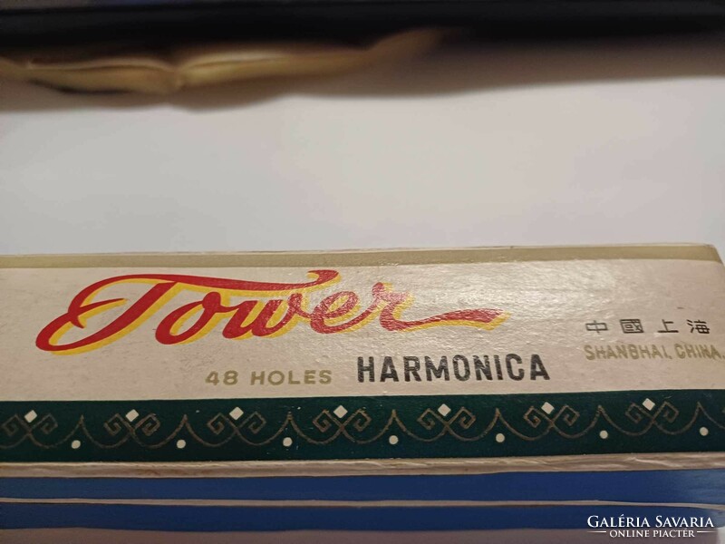 Old tower harmonica in its original box