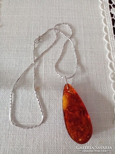 Old cast amber pendant on a beautiful, new silver-plated chain