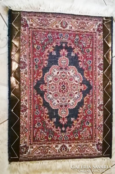 Tabriz in front of the door, a small hand-knotted, thick, stuffed wool carpet