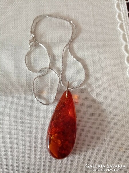 Old cast amber pendant on a beautiful, new silver-plated chain