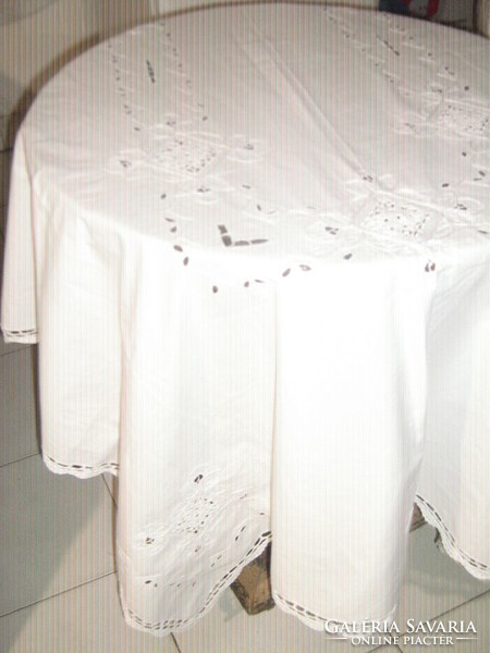 Elegant white tablecloth with a beautiful hand-crocheted border and a crochet insert