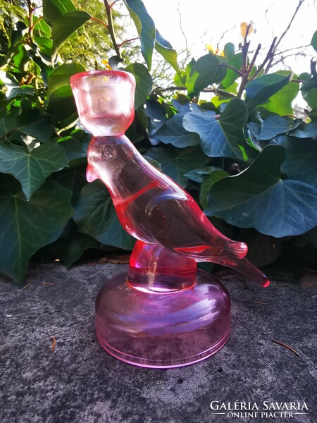 Glass candle holder in the shape of a bird