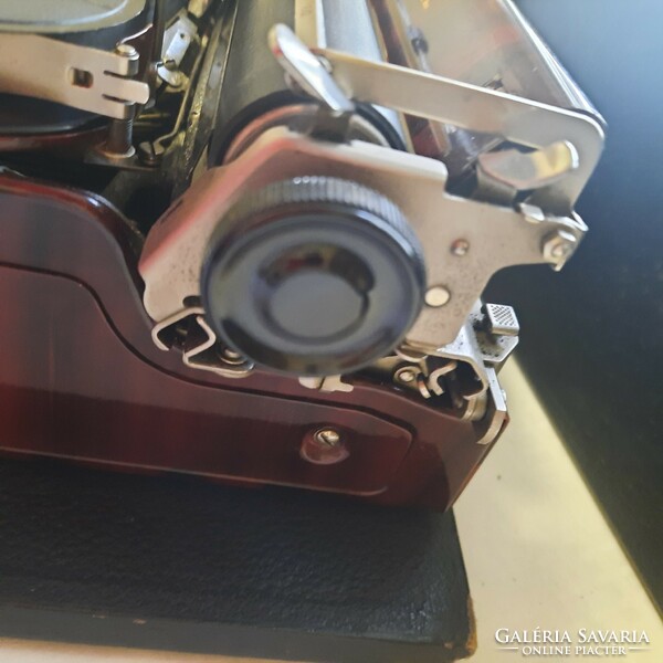 Antique burgundy-gold continental 340 typewriter with original box and cleaning brush