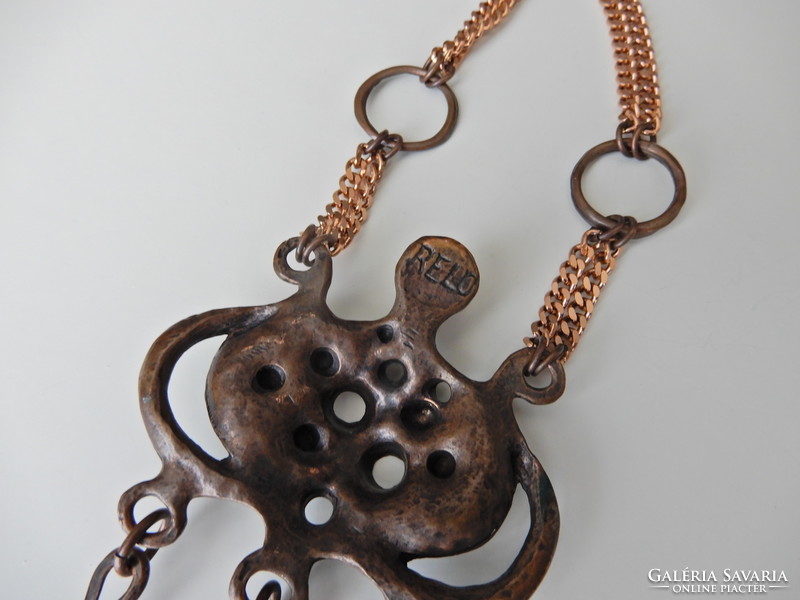 Old large relo brutalist bronzed pendant on a copper necklace