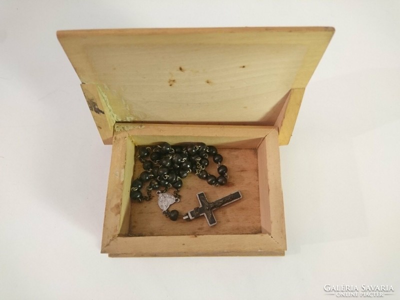 Old antique rosary, reader, crucifix in a carved wooden box