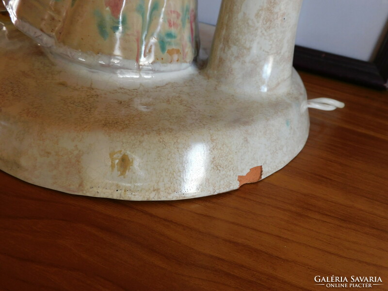 Vintage ceramic lamp with a girl dressed in folk costume