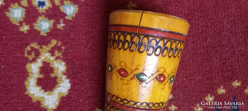 Painted and carved wooden candle holder