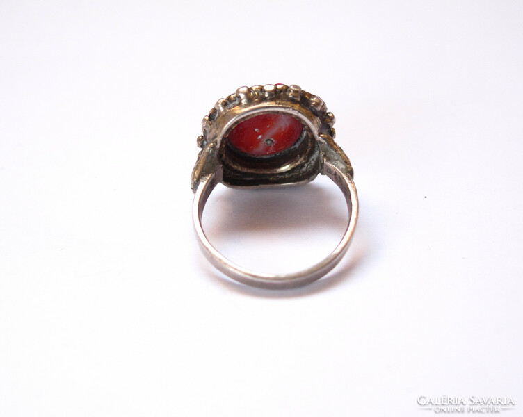 Old silver ring with coral.