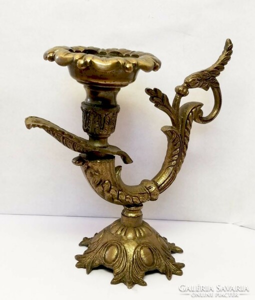 Baroque style bronze candle holder with characteristic decoration. from France