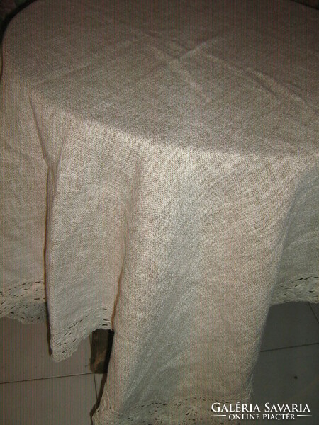 Beautiful woven tablecloth with white lacy edges