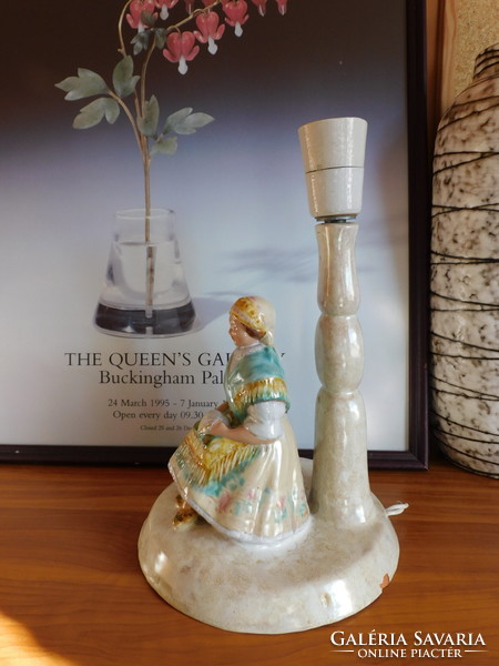 Vintage ceramic lamp with a girl dressed in folk costume