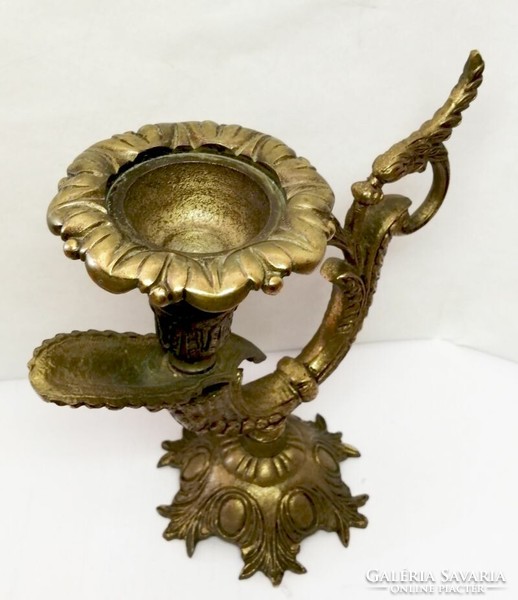 Baroque style bronze candle holder with characteristic decoration. from France