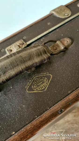 Old suitcase with wooden overlay