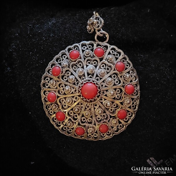 Old filigree silver pendant with coral stones