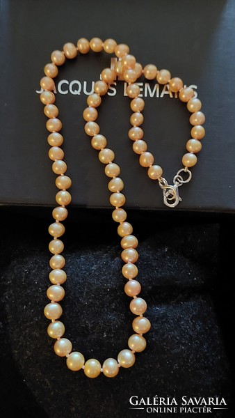 Beautiful gold-colored genuine cultured pearl necklace with silver fittings and knotted lacing