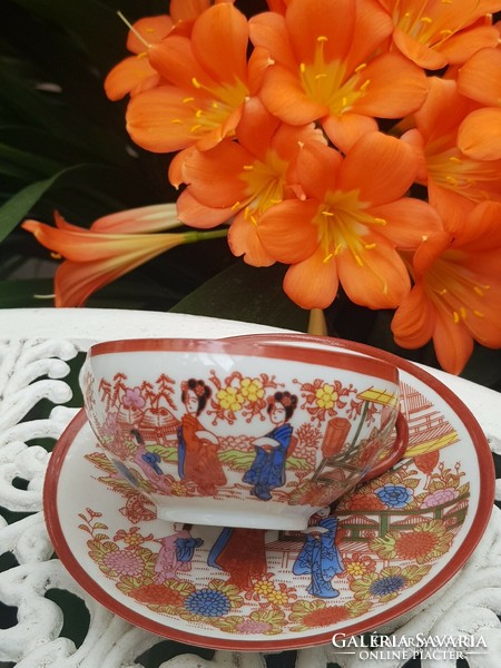 Oriental geisha eggshell porcelain cup and saucer