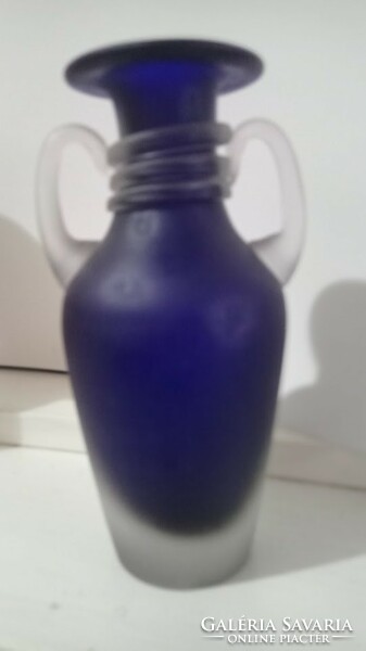 A blue Murano glass vase is a stylish glass vase with two handles