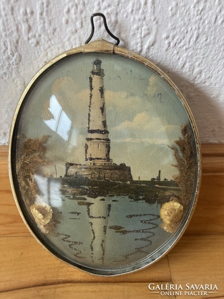 Memorial lighthouse in an oval frame