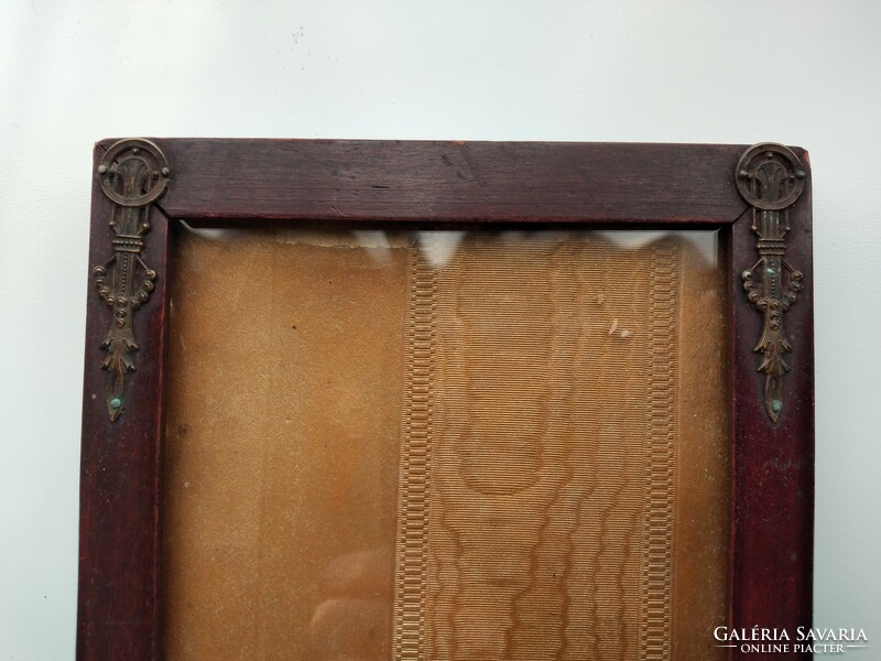 Wooden picture frame with metal decoration