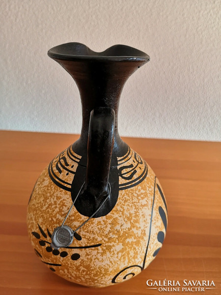An authentic copy of an antique jug with a seal