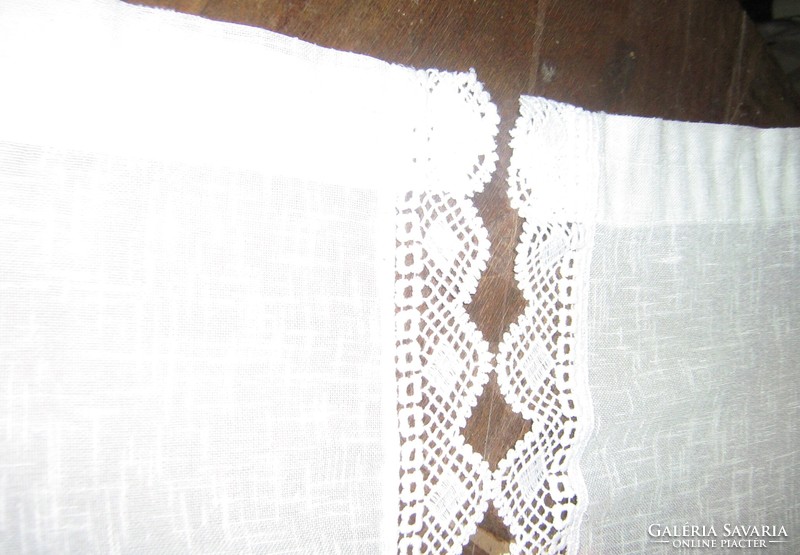 A pair of beautiful vintage style stained glass curtains with a lace edge