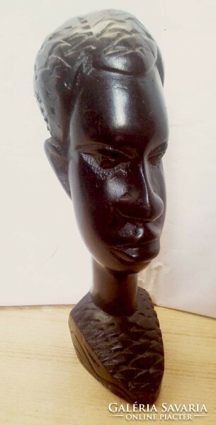 Ebony colored native sculpture, black polished head sculpture from South Africa