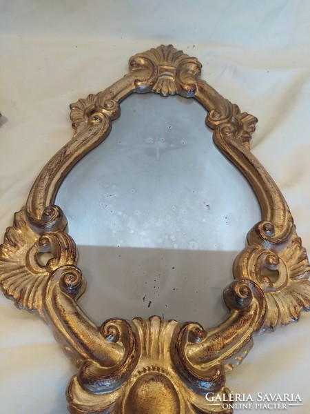 A pair of mirrors with an antique effect