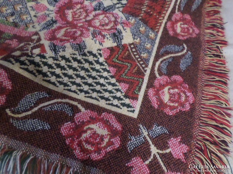 Thicker woven tablecloth, couch or armchair cover with beautiful colors.