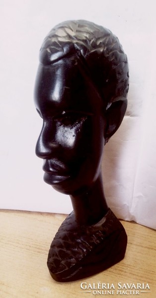 Ebony colored native sculpture, black polished head sculpture from South Africa