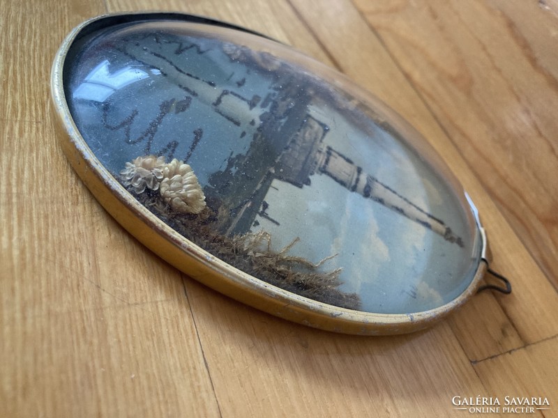 Memorial lighthouse in an oval frame