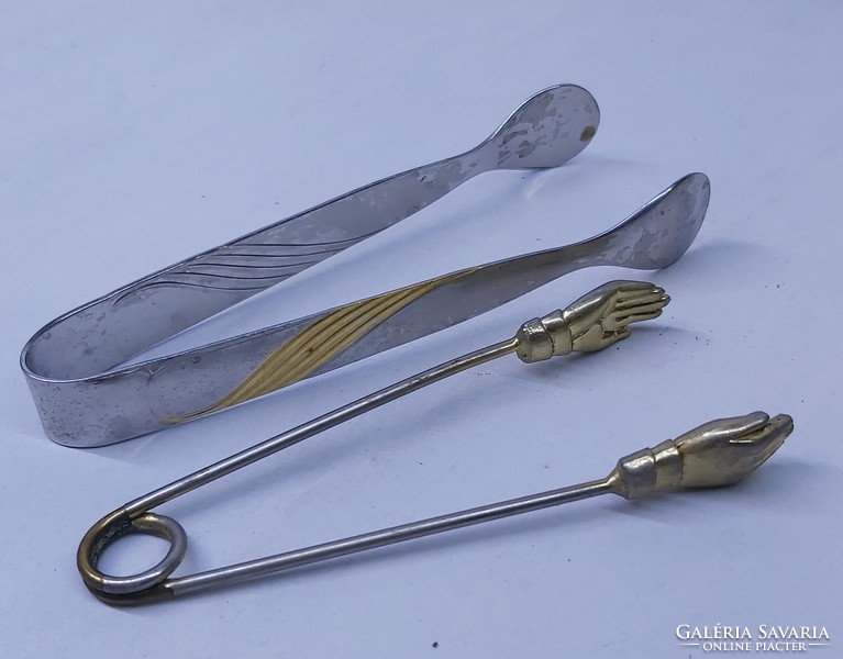 2 sugar tongs, sugar tongs, one in the shape of a special hand