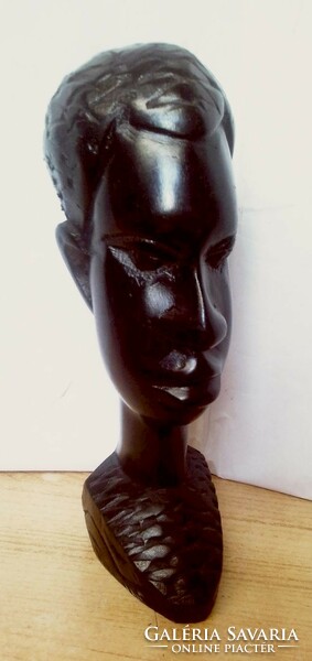 Ebony colored native sculpture, black polished head sculpture from South Africa