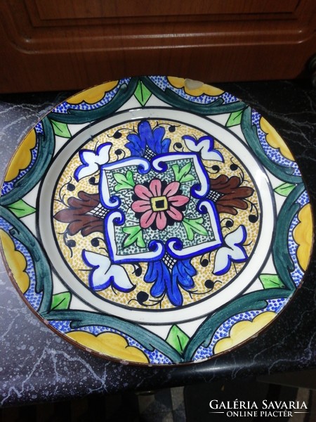A marked wall plate from a collection has a small damage, it is in the condition shown in the pictures