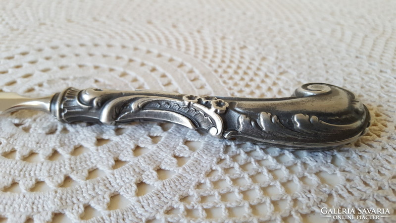 A beautiful leaf opener with a silver-plated handle