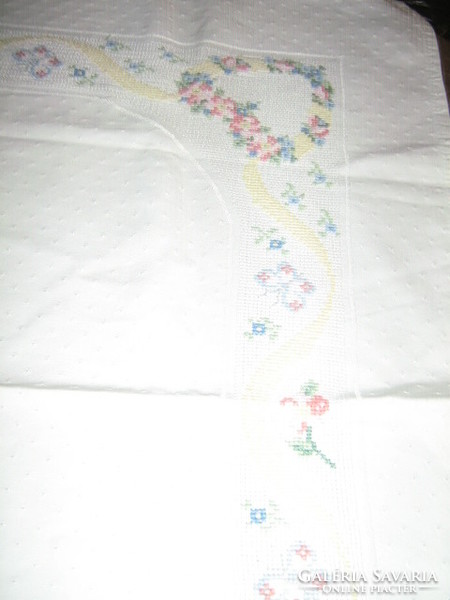 Beautiful white hand-embroidered damask tablecloth with tiny cross-stitch floral hearts and butterflies