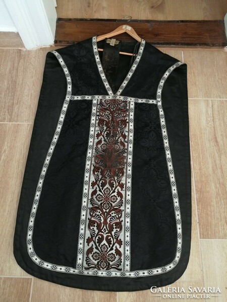 Black brocade vestment with silver trim