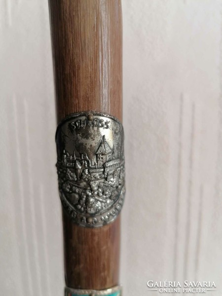 Antique hiking stick with badge and stick label