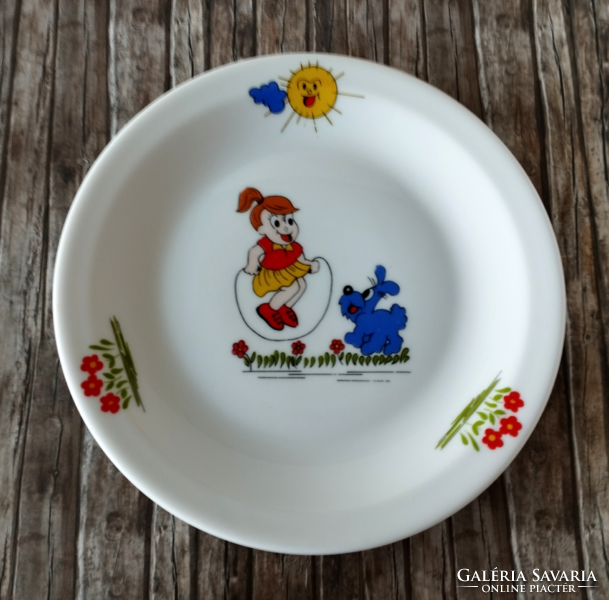 A set of porcelain children's flat and deep plates with a fairytale pattern