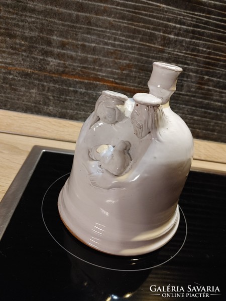 Ceramic candle holder of a married couple with their child