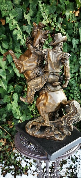Monumental cowboy bronze statue