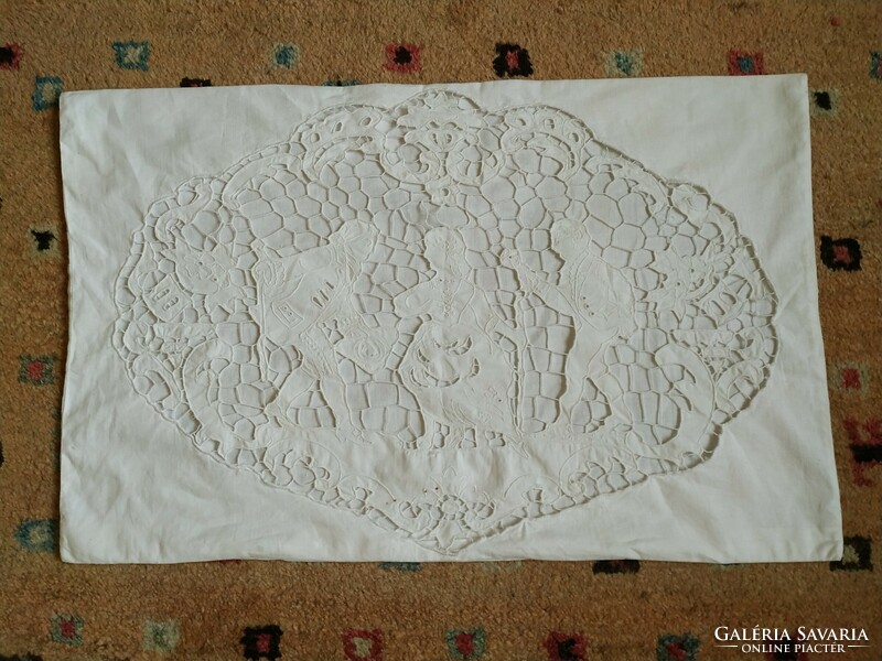 An old decorative cushion cover with a hinged scene