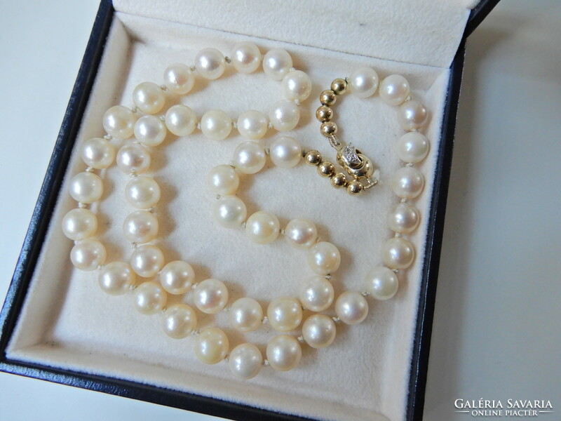 Genuine Akoya pearl jewelry set with 14 carat gold setting and diamonds