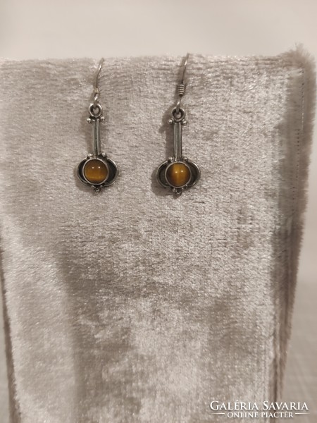 Interesting silver earrings with a tiger's eye stone