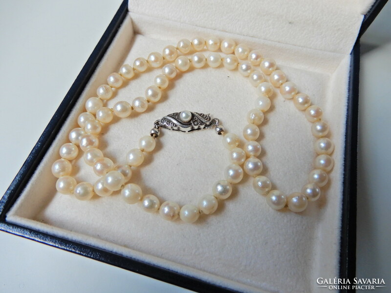 Old string of real pearls with a silver clasp