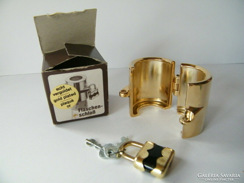 Gold-plated, padlocked glass stopper and cap