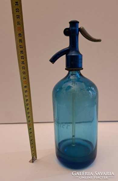 Moschendorf liter blue, labeled soda bottle with head