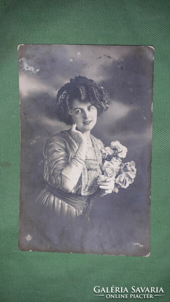 1912. Antique postcard very pretty lady with flowers according to the pictures