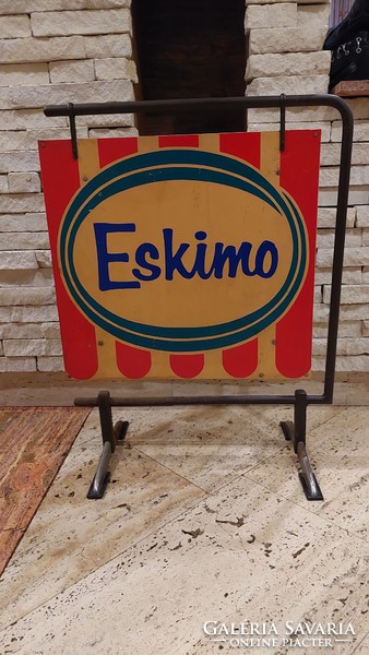 Retro eskimo ice cream advertisement with stand